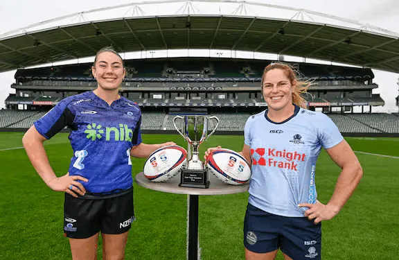 Captains of the Blues and NSW Waratahs pose with the trophy ahead of the Women’s Super Rugby Champions Final 2025.