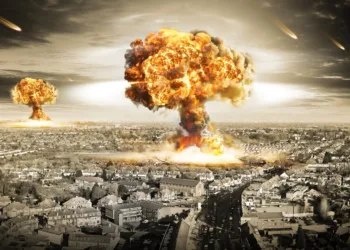 Mushroom clouds rise over a cityscape during a nuclear explosion, symbolizing the devastating consequences of nuclear war.